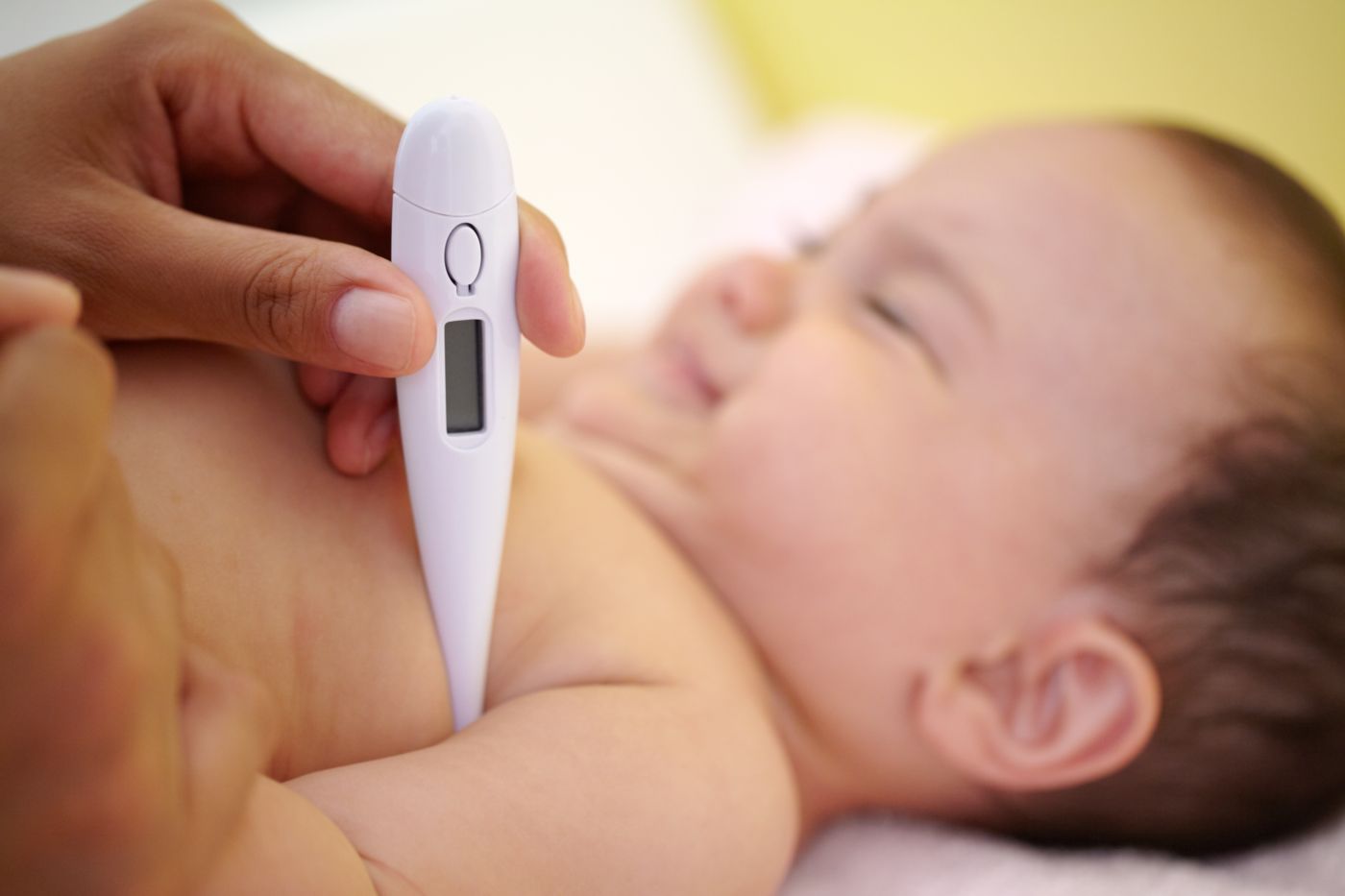 Child with high fever being comforted